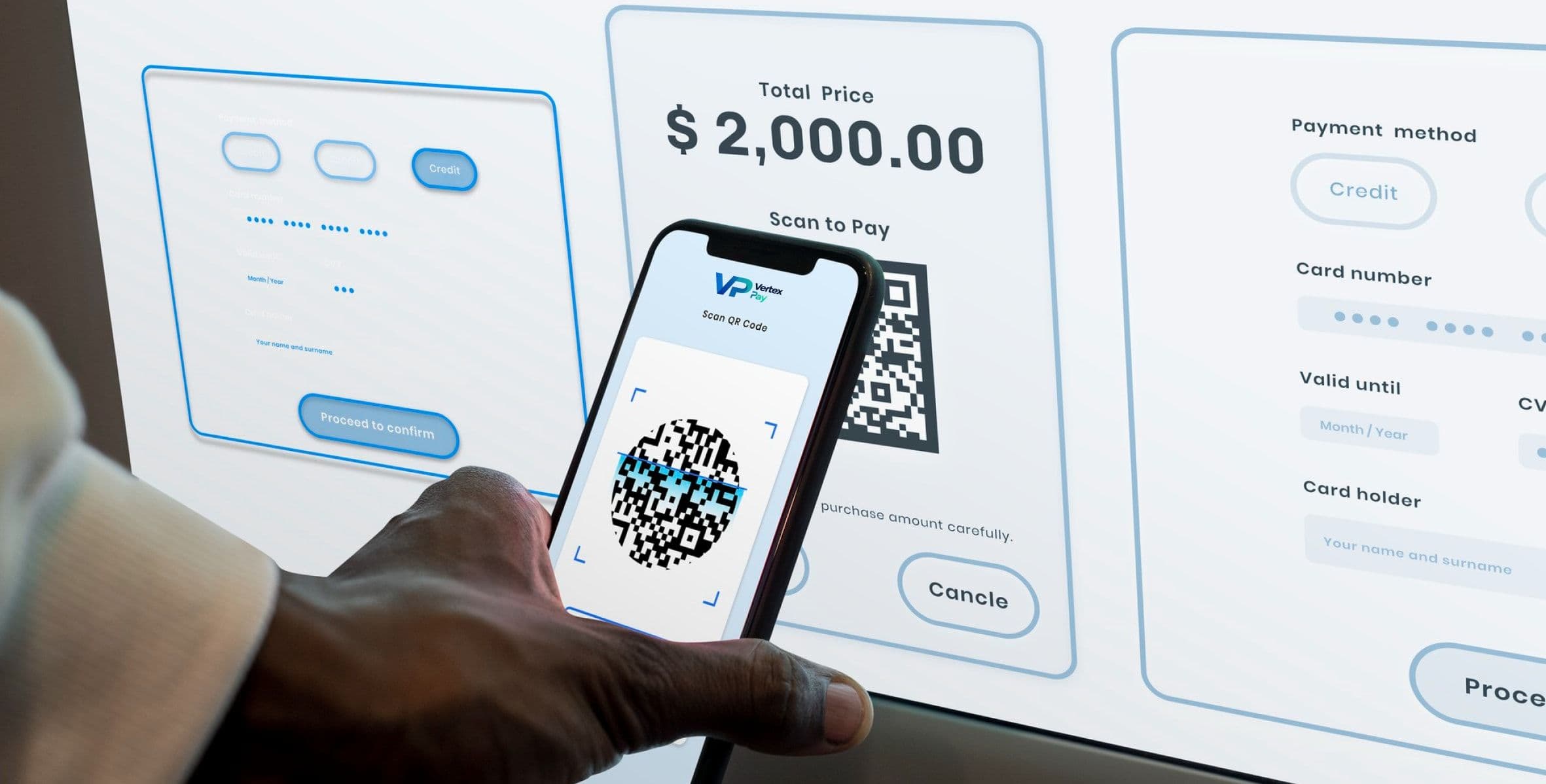 A hand holding a phone up to scan a QR code on a payment screen