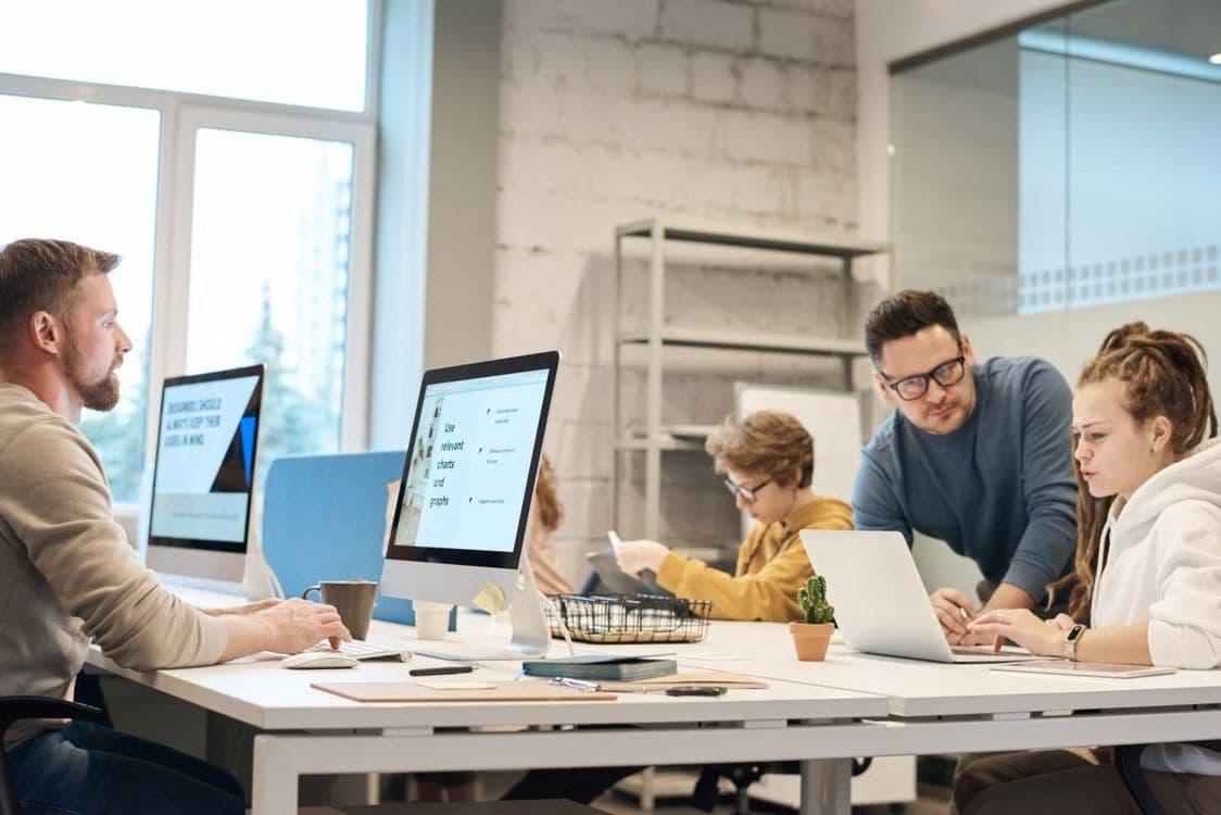 A team working together at a shared desk