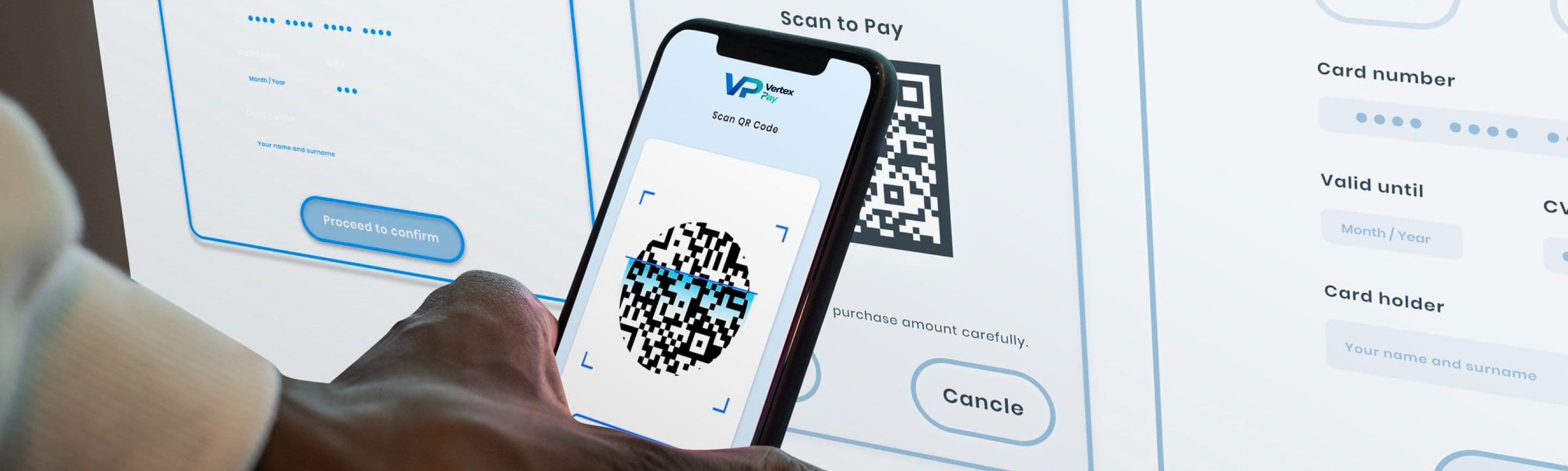 A hand holding a phone up to scan a QR code on a payment screen
