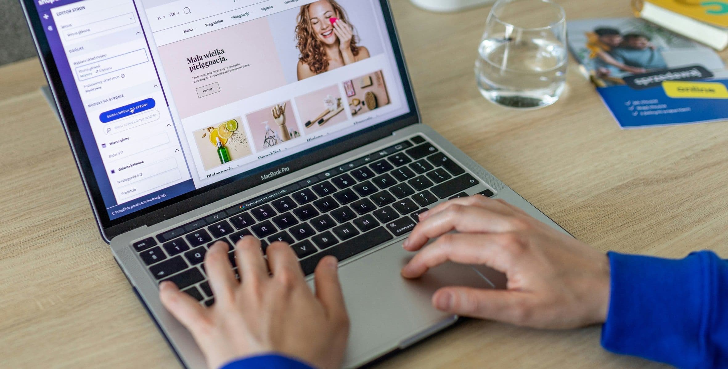 Hands typing on a laptop open on an online beauty shop